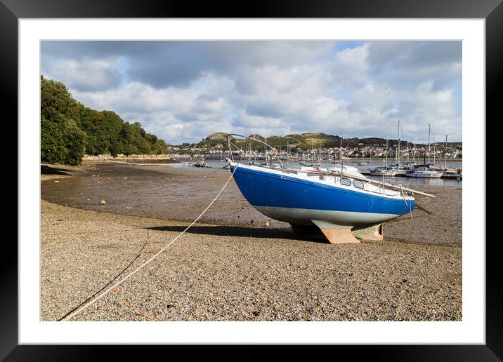 Boat beached at low tide Framed Mounted Print by Jason Wells