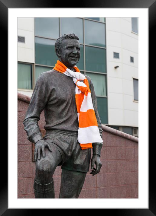 Jimmy Armfield statue wrapped in an orange and white scarf Framed Mounted Print by Jason Wells