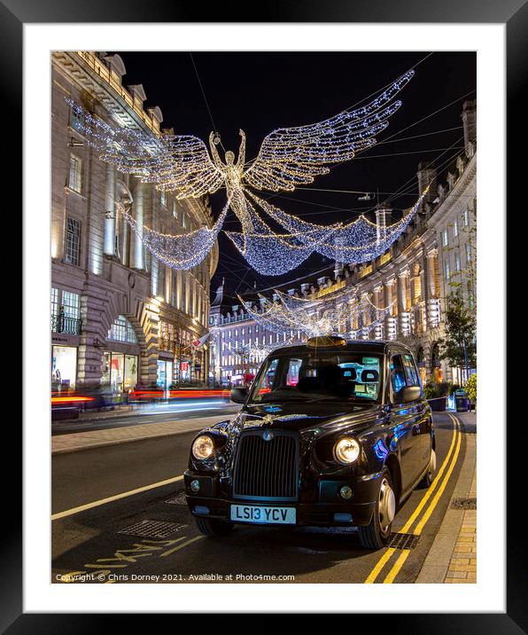 Taxi with Regent Street Christmas Lights in London, UK Framed Mounted Print by Chris Dorney