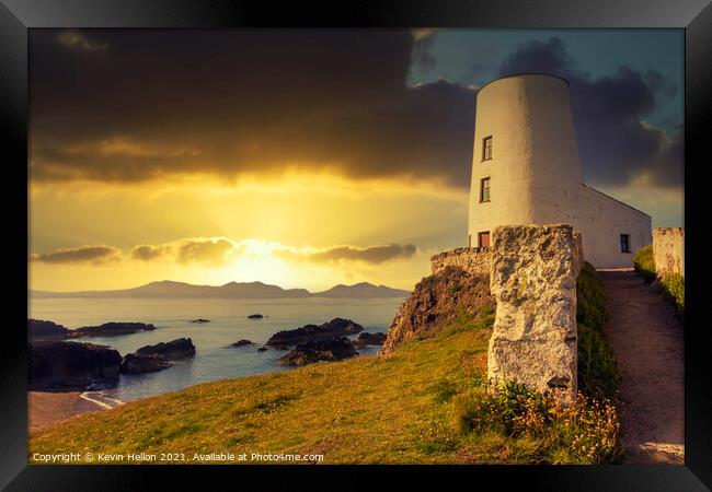Tyr Mawr lighthouse at sunse Framed Print by Kevin Hellon
