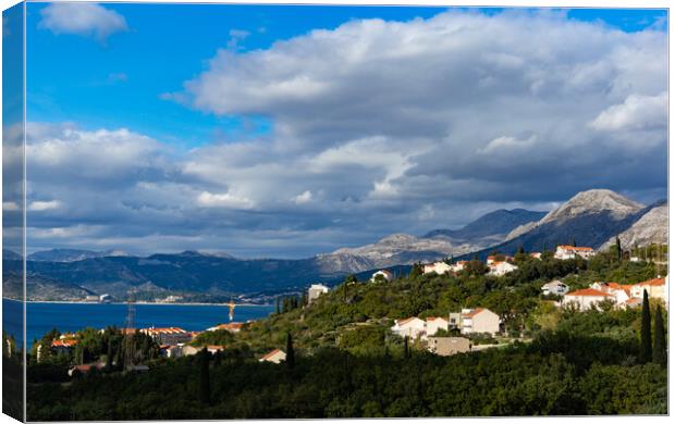 Mountains on the Adriatic coast. Settlements on the shore. Canvas Print by Sergey Fedoskin