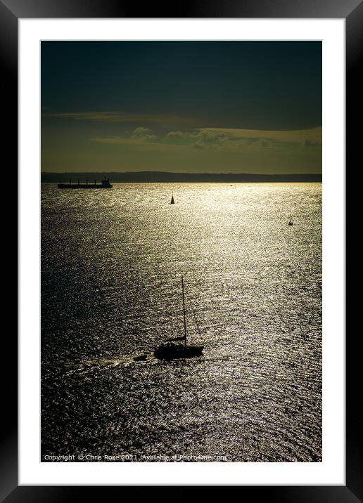A silhouetted sailing boat Framed Mounted Print by Chris Rose