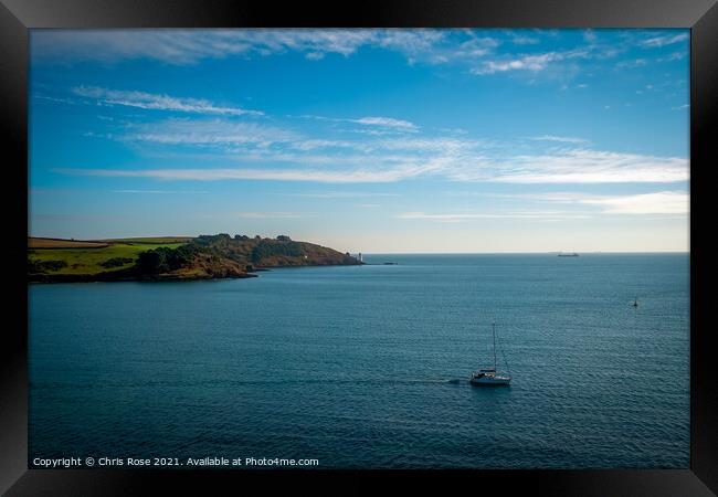A sailing boat passes St Anthony Head Framed Print by Chris Rose