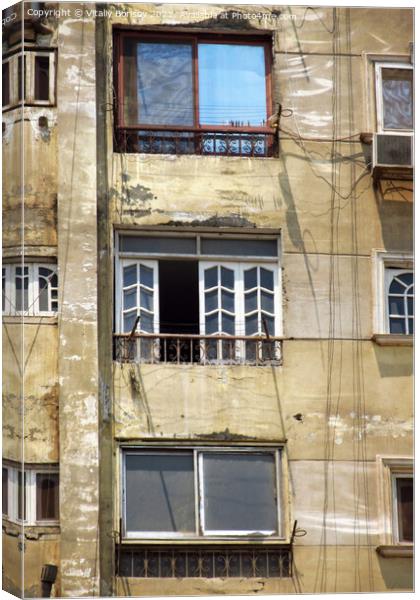 View of the wall of a high-rise building, with balconies and windows Canvas Print by Vitaliy Borisov
