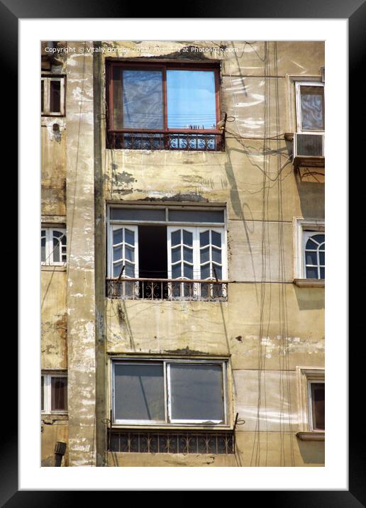 View of the wall of a high-rise building, with balconies and windows Framed Mounted Print by Vitaliy Borisov