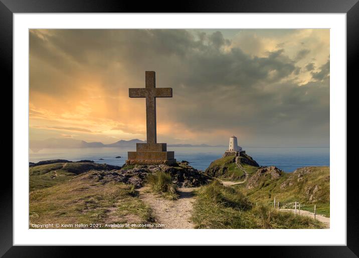 St Dwynwen’s Cross and Tyr Mawr lighthouse at sunset,  Framed Mounted Print by Kevin Hellon