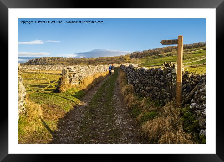 Hill walking between Langcliffe, Attermire Scar and Settle Framed Mounted Print by Peter Stuart