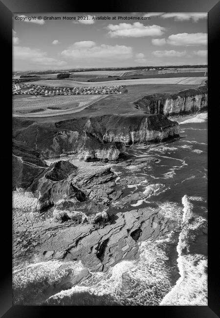 Thornwick Bay looking north monochrome Framed Print by Graham Moore