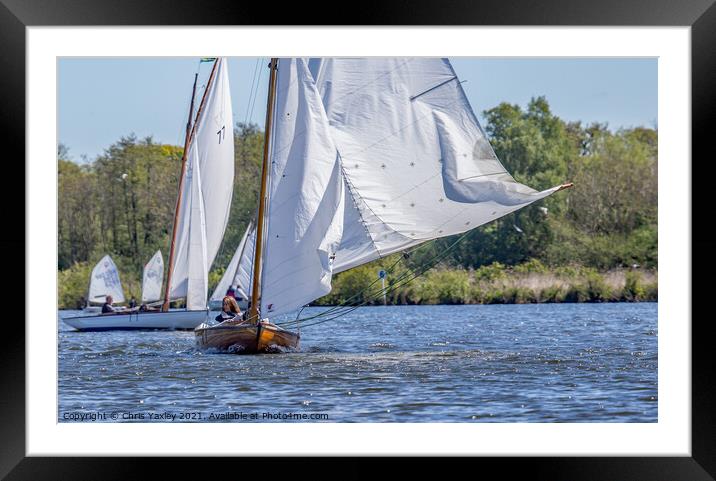 Head on view of traditional sailing boat on Wroxham Broad, Norfolk Framed Mounted Print by Chris Yaxley