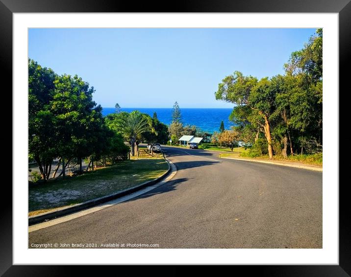 Road running through Rainbow Beach, Queensland, Australia Framed Mounted Print by John Brady