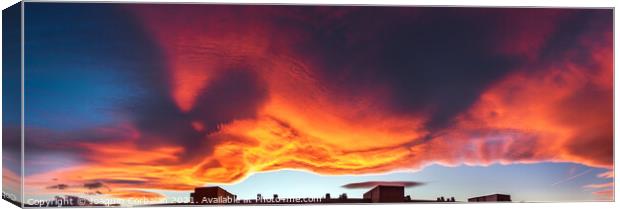 A large cloud with curious wavy shapes and warm reddish colors d Canvas Print by Joaquin Corbalan