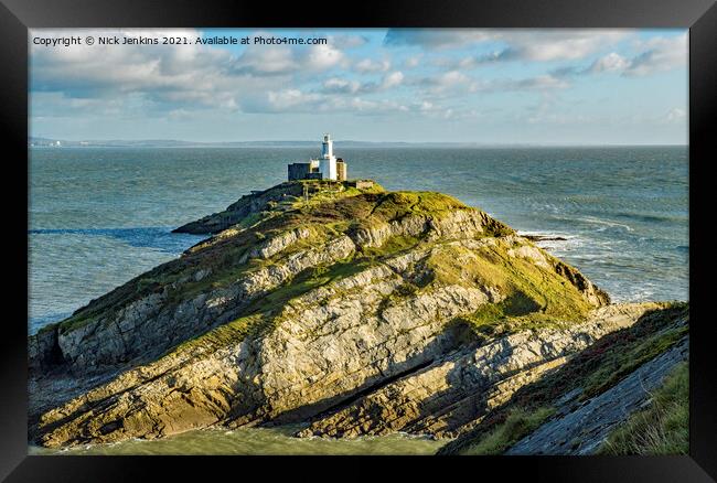 Mumbles Lighthouse on a rock in Gower south Wales Framed Print by Nick Jenkins