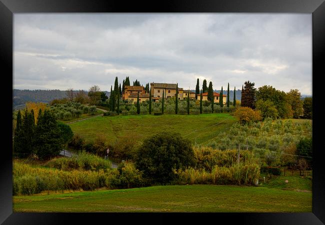 Typical country houses and cypresses in Tuscany Framed Print by Erik Lattwein