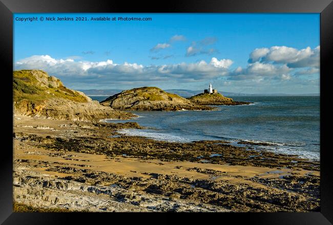 Mumbles Lighthouse from Bracelet Bay  Framed Print by Nick Jenkins