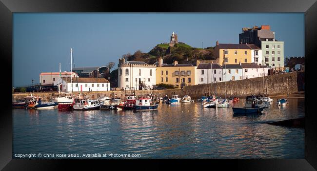 Tenby, pastel coloured buildings line the harbour Framed Print by Chris Rose