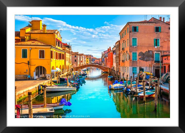 Chioggia town in venetian lagoon, water canal and boats. Framed Mounted Print by Stefano Orazzini