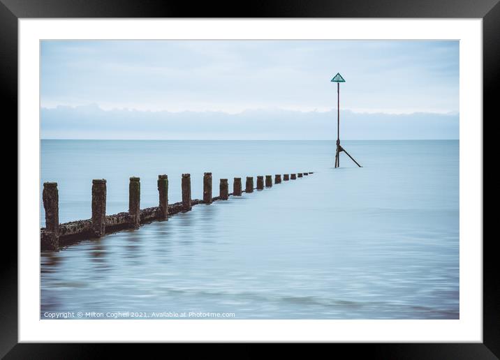 Groynes at high tide on East Wittering beach Framed Mounted Print by Milton Cogheil
