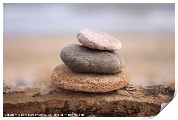 Pebble stack on drift wood Print by Beth Hartley