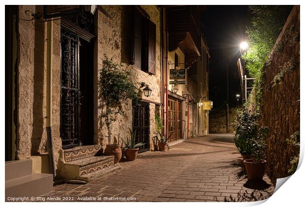 dark alley lit by a streetlight in the old town of Chania Print by Stig Alenäs