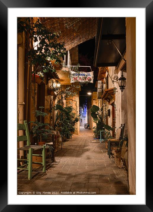 Alleyway in the old town of Chania with chairs and green plants  Framed Mounted Print by Stig Alenäs