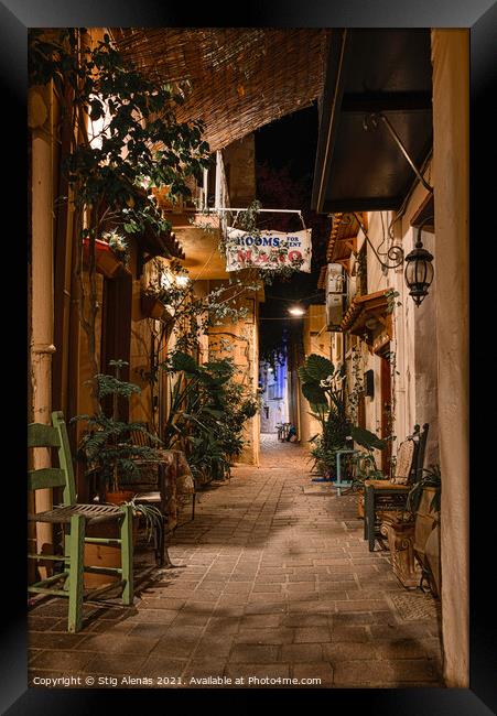 Alleyway in the old town of Chania with chairs and green plants  Framed Print by Stig Alenäs