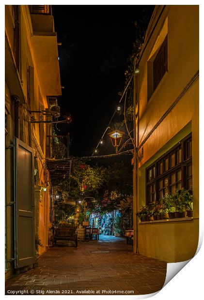 a illuminated narrow alley with gardens and restaurants in the o Print by Stig Alenäs