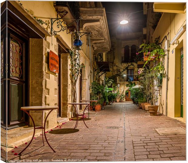 picturesque alley in the old town of Chania, illuminated with a  Canvas Print by Stig Alenäs