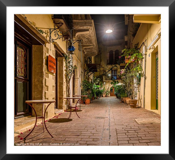 picturesque alley in the old town of Chania, illuminated with a  Framed Mounted Print by Stig Alenäs