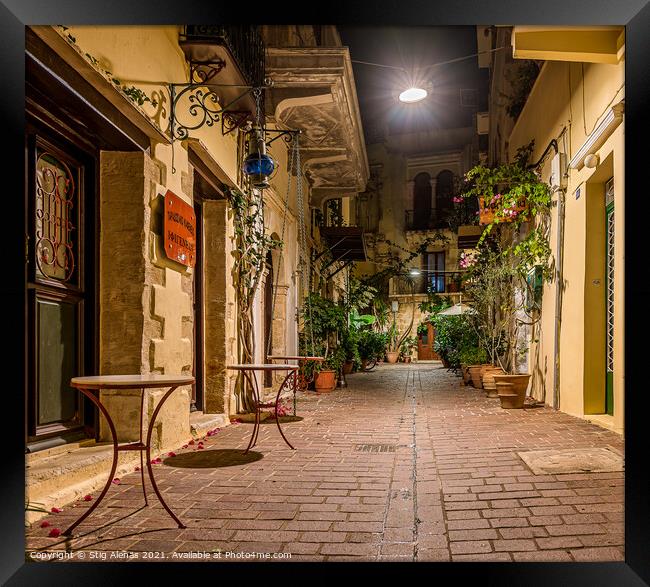 picturesque alley in the old town of Chania, illuminated with a  Framed Print by Stig Alenäs