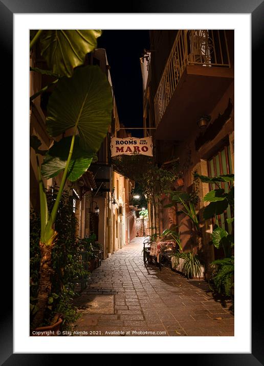 Narrow alleyway with green plants at the night illuminated in th Framed Mounted Print by Stig Alenäs