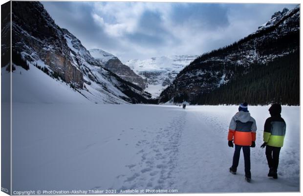 Tourists kids are walking on top of the frozen lake Louise Canadian and Tourists are enjoying winter Canvas Print by PhotOvation-Akshay Thaker