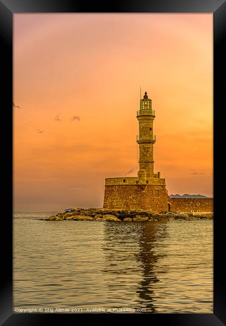 the lighthouse in the harbour of Chania glowing in the sunrise Framed Print by Stig Alenäs