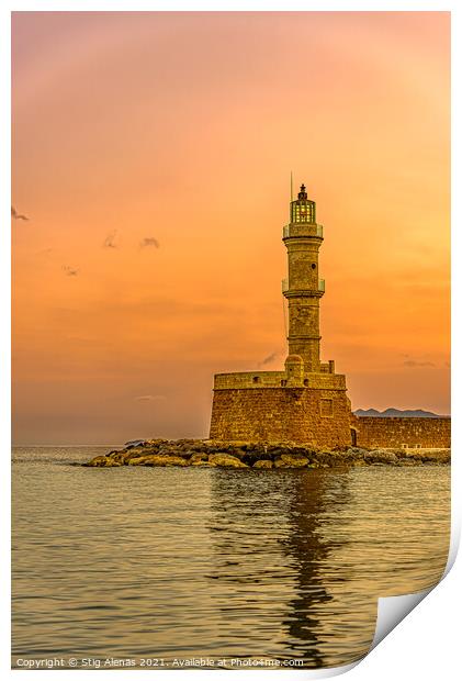 the lighthouse in the harbour of Chania glowing in the sunrise Print by Stig Alenäs