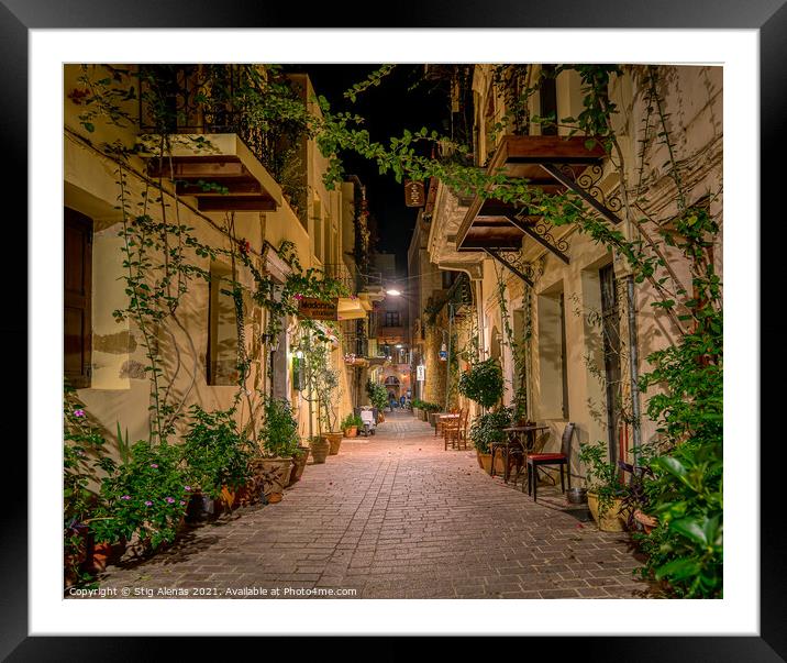 The illuminated narrow alley Antoniou Gampa with flowers and bal Framed Mounted Print by Stig Alenäs