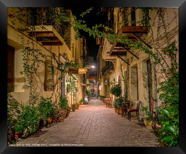 The illuminated narrow alley Antoniou Gampa with flowers and bal Framed Print by Stig Alenäs