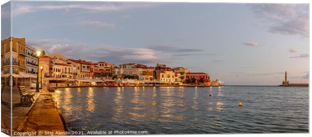 the golden hour in Chania harbour with a view of the bay and the Canvas Print by Stig Alenäs