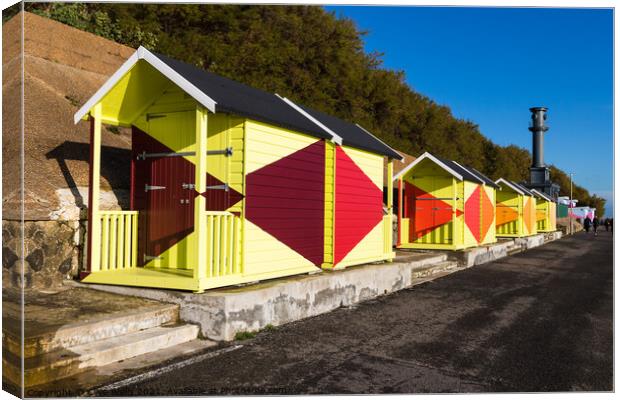 Bright beach huts on Folkestone sea front Canvas Print by Clive Wells