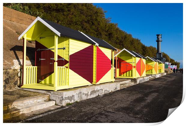Bright beach huts on Folkestone sea front Print by Clive Wells