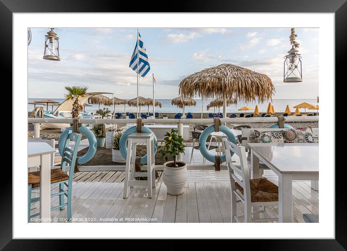 greek restaurant with blue and white tables right on the beach w Framed Mounted Print by Stig Alenäs