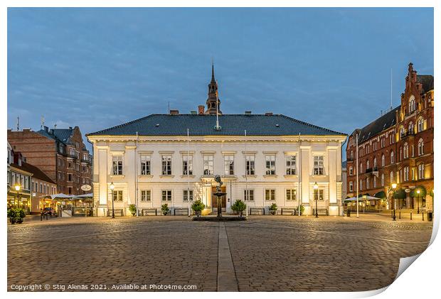 the town hall reflecting in the cobbled square at night Print by Stig Alenäs
