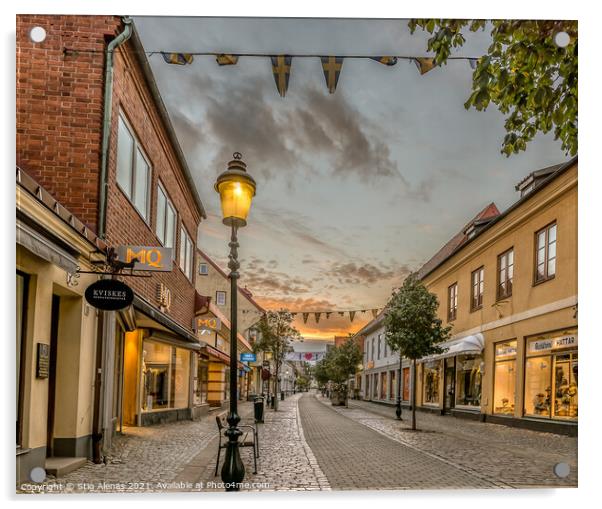 pedestrian shopping street in Ystad with a streetlight an early  Acrylic by Stig Alenäs
