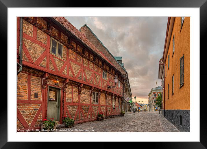 Apoteksgården an old half-timbered house in the light of street Framed Mounted Print by Stig Alenäs