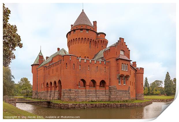 a romantic red castle with a tall tower surrounded by a moat Print by Stig Alenäs