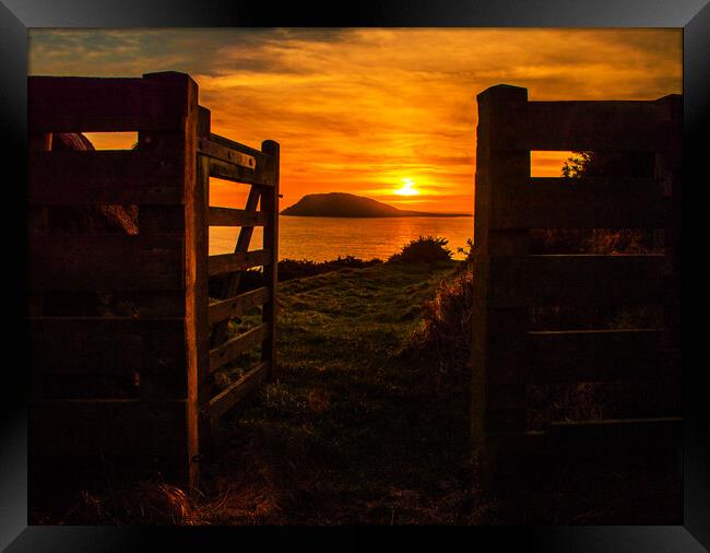 Sunset through the gate over Bardsey Island Framed Print by Dafydd Emyr Jones