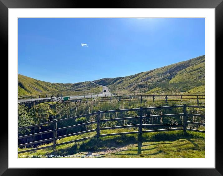 Road running through the Yorkshire Dales, England Framed Mounted Print by John Brady