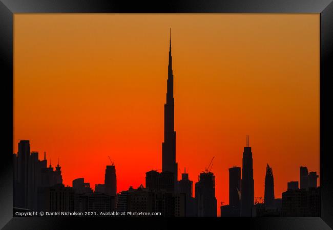 Red Sky over Dubai Framed Print by Daniel Nicholson