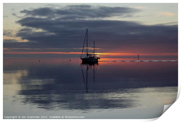 Yacht caught in the sunset Print by Ian Cramman