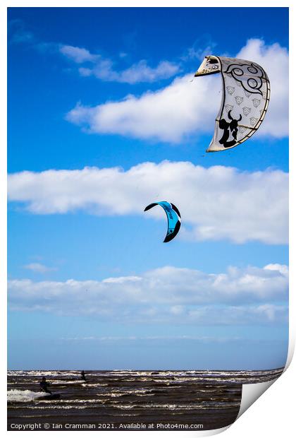 Kite-surfers on the water Print by Ian Cramman