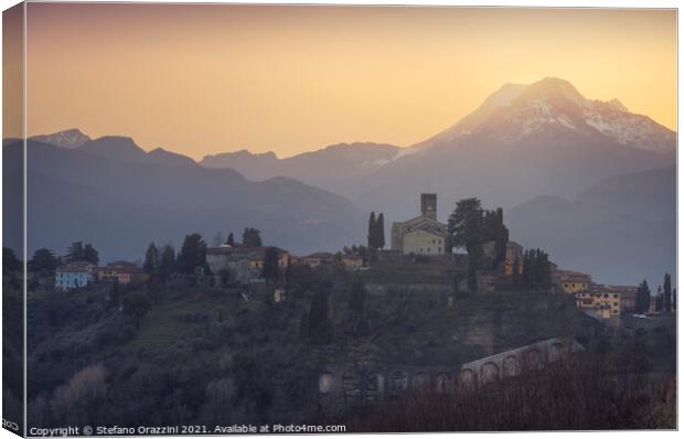 Barga town and Alpi Apuane mountains in winter. Tuscany Canvas Print by Stefano Orazzini