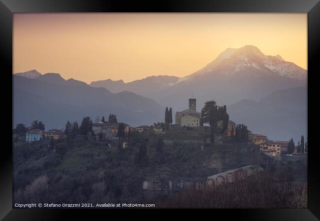 Barga town and Alpi Apuane mountains in winter. Tuscany Framed Print by Stefano Orazzini